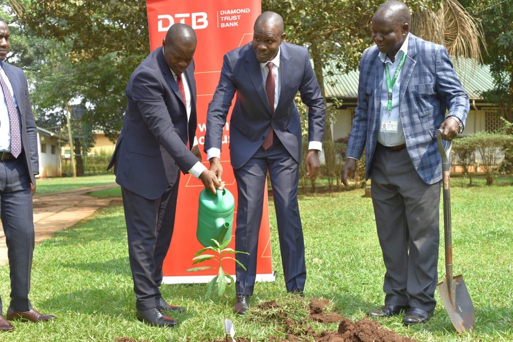 Stuart Maniraguha - Acting Executive Director of National Forestry Authority – Uganda. and the CEO DTB - Uganda Mr Godfrey Sebaana planting a tree in commemoration of the partnership.